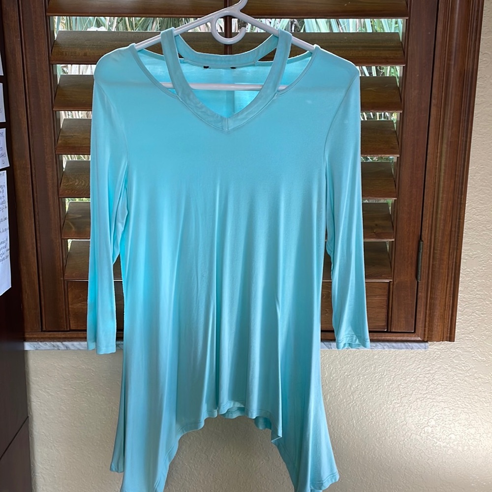 Light blue; three-quarter length, cotton blend.